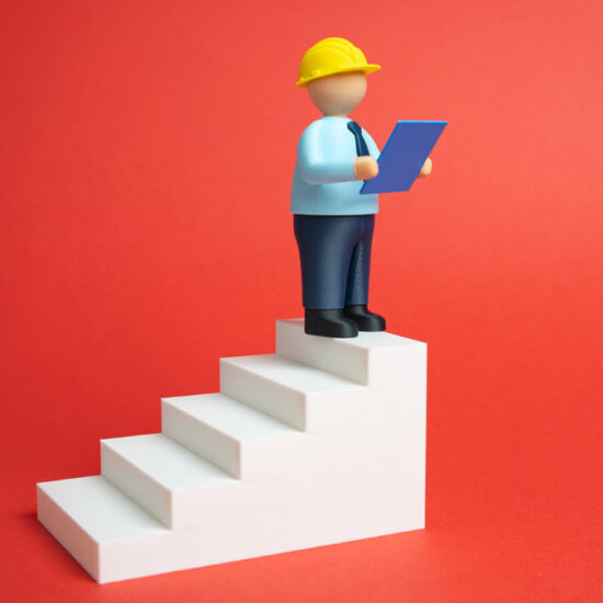 A small figure wearing a yellow hard hat and a blue shirt stands on the top step of white stairs, holding a blue clipboard against a red background.