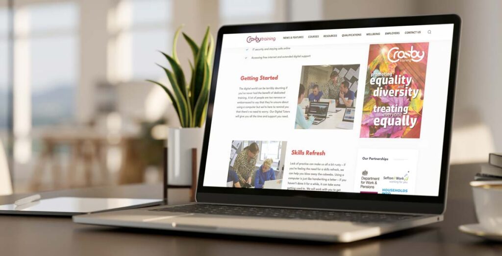 A laptop open on a desk: the screen is displaying this web page.