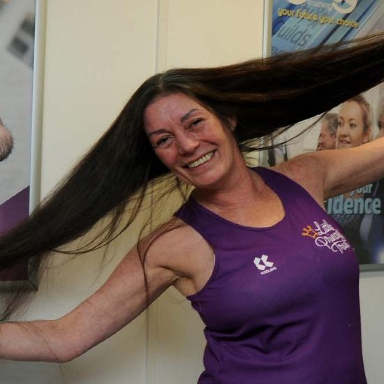 Learner poses before visiting the Crosby Training Salon.